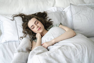 Beautiful woman sleeping in bed at home - VPIF06034