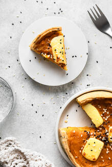 Studio shot of freshly baked butternut squash pie with sesame seeds - FLMF00807