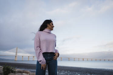 Young woman enjoying sunset at beach - DCRF01238