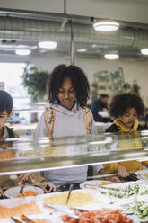 Students taking food during lunch break in cafeteria at school - MASF30023