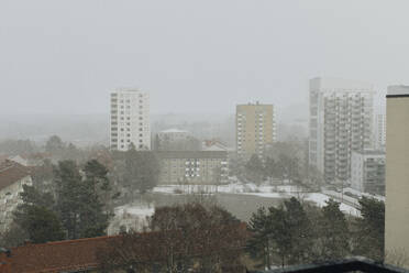 Buildings in city against sky during winter - MASF30318