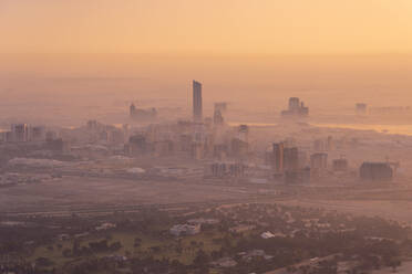 United Arab Emirates, Dubai, View of city at foggy dawn - TAMF03371