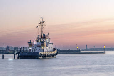 Germany, Schleswig-Holstein, Kiel, Ship moored in Holtenau harbor at dusk - KEBF02302