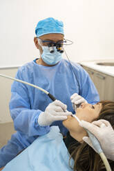 Dentists analyzing patient at clinic - MMPF00066