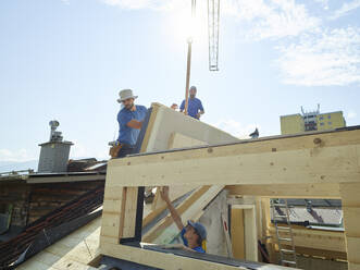 Workers working at construction site on sunny day - CVF01978