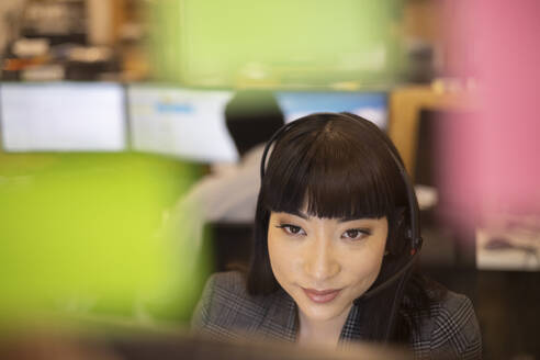 Close up businesswoman in headset working in office - CAIF32861