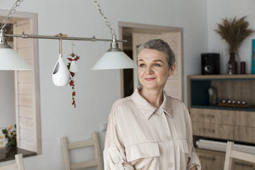 Confident mature woman with short grey hair at home - LLUF00631