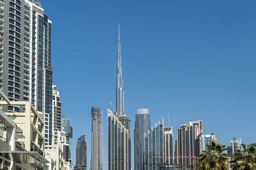 United Arab Emirates, Dubai, Tall skyscrapers of Business Bay district with Burj Khalifa in center - TAMF03383