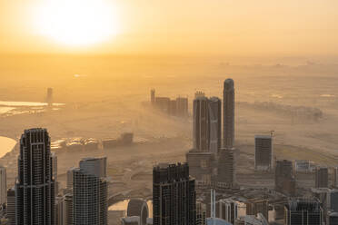 United Arab Emirates, Dubai, Business Bay at foggy sunrise - TAMF03390