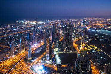 United Arab Emirates, Dubai, Elevated view of illuminated downtown at night - TAMF03396