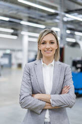 Portrait of confident businesswoman in factory - DIGF18032