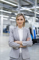 Portrait of confident businesswoman in factory - DIGF18033