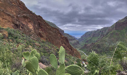 Spain, Gran Canaria, Cloudy sky over Guayadeque Ravine in summer - BSCF00659