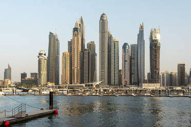 United Arab Emirates, Dubai, Dubai Marina with tall skyscrapers in background - TAMF03433