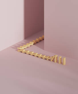 Studio shot of falling domino pieces placed around corner - DRBF00293