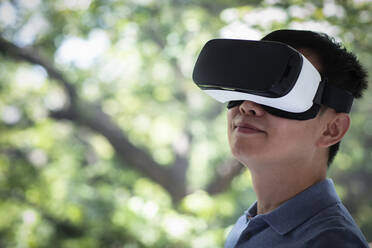 Close up man using VR headset - CAIF33231