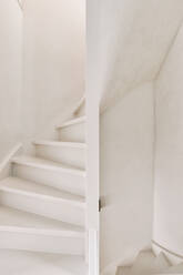 White staircase between two floors in the hallway of a modern house - ADSF35142