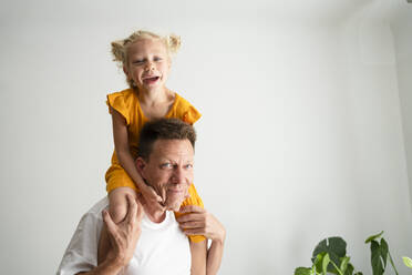 Father and daughter having fun at home - SVKF00374