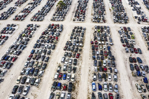 Aerial view of many vehicles in a car park junkyard, Palmdale, Florida, United States. - AAEF14721