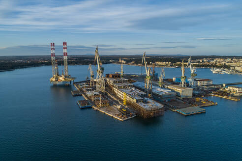 Aerial view of Pula harbour and a shipyard, Pula, Istria, Croatia. - AAEF14862