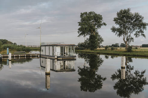 Reflection of houseboat on Yser River - MFF09250