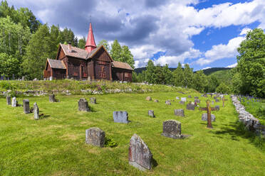 Norway, Viken, Rollag, Cemetery in front of medieval stave church in summer - STSF03294