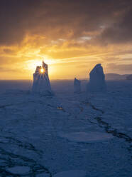 Sunset over an unusual iceberg near Petermann Island, Antarctica, Polar Regions - RHPLF22111