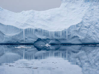 Large iceberg grounded on a reef at Peter I Island, Bellingshausen Sea, Antarctica, Polar Regions - RHPLF22113