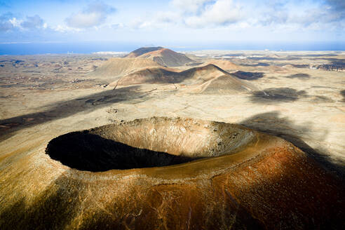 Majestic crater of Hondo volcano (Calderon Hondo) with the ocean in background, Corralejo, Fuerteventura, Canary Islands, Spain, Atlantic, Europe - RHPLF22172