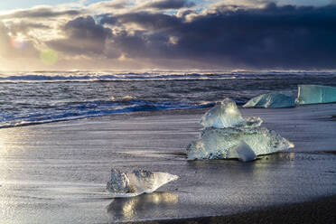 Icebergs from melting glacier on black sand beach near Jokulsarlon glacier lagoon, Vatnajokull National Park, Iceland, Polar Regions - RHPLF22184