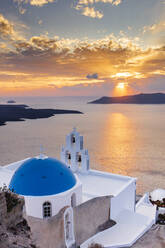 A white church with blue dome overlooking the Aegean Sea at sunset, Santorini, Cyclades, Greek Islands, Greece, Europe - RHPLF22245