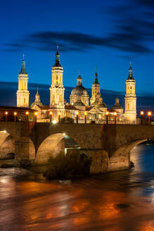 Basilica del Pilar Cathedral with stone bridge crossing Ebro River at night, Zaragoza, Aragon, Spain, Europe - RHPLF22265