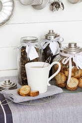 Cardamom bread crusts with cup of coffee - FOLF11428