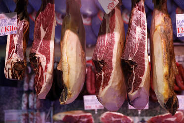 Cured ham (Jamon Iberico) hanging at market, Madrid, Spain, Europe - RHPLF22277