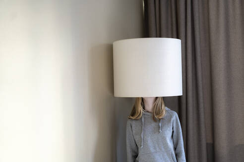 Teenage girl under lampshade - FOLF11838