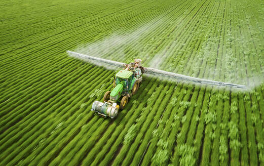 Aerial View of sprinkler at work among the cultivated fields, Beit Alfa, Northern District, Israel. - AAEF14908