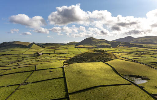 Aerial view of the volcanic island Terceira with fields and houses, Azores, Portugal. - AAEF14947