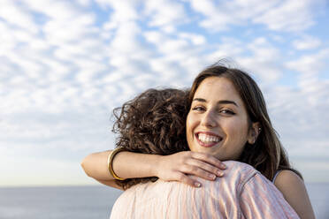 Happy young couple hugging each other - WPEF06125