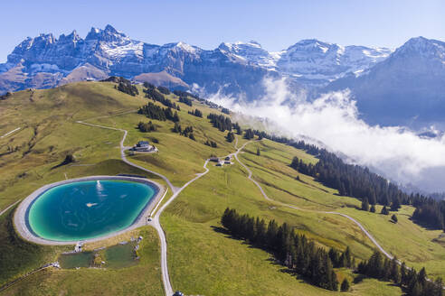 Aerial view of an artificial lake on mountain top in Champéry, Valais, Switzerland. - AAEF15059