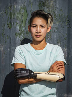 Portrait of athletic woman with prosthetic arm - TETF01651