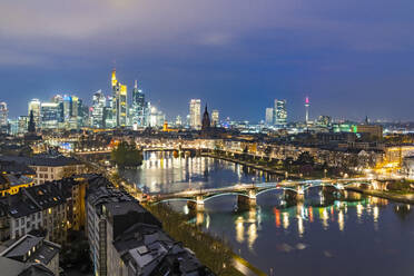 Lights of the Skyline of Frankfurt business district reflected in River Main at dusk, Frankfurt am Main, Hesse, Germany Europe - RHPLF22453