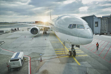 Germany, Hesse, Frankfurt, Commercial airplane waiting on airport tarmac - RORF02935