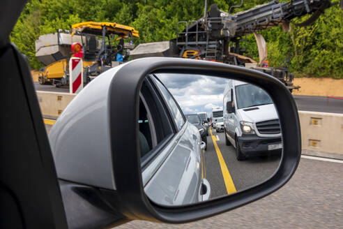 Traffic jam reflecting in side-view mirror - NDF01494