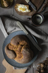 Studio shot of loaf of homemade pumpkin bread and mug of coffee - EVGF04054