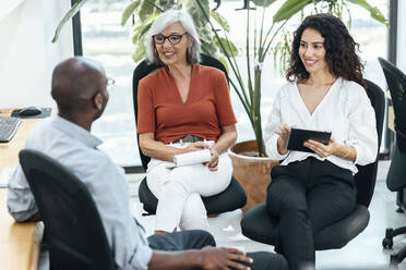 Business colleagues having discussion at office - JSRF02172