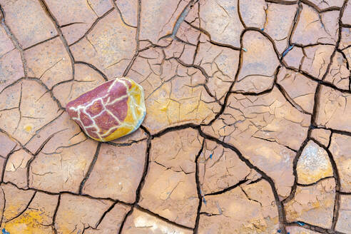 Full frame textured background of dry soil covered with cracks on sunny day in barren - ADSF36078