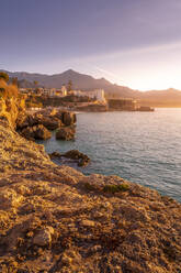 View of coastline and Iglesia de El Salvador Church at sunrise in Nerja, Costa del Sol, Malaga Province, Andalusia, Spain, Mediterranean, Europe - RHPLF22540