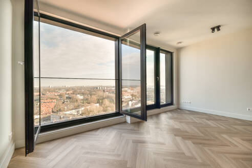 Plastic window and white wall in empty light room at home - ADSF36190