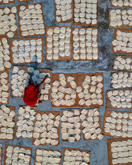 Aerial view of Women at work on the preparation of natural fabric, Barga, Rajshahi, Bangladesh. - AAEF15078