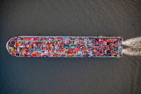 Aerial view of people onboard of a passenger ship along Buriganga river, Keraniganj, Dhaka, Bangladesh. - AAEF15080